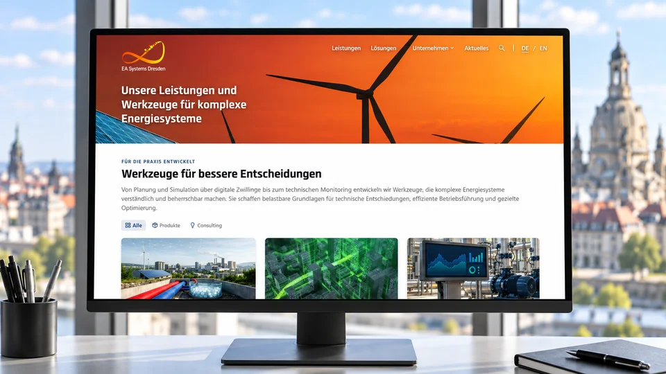 Monitor mit der neuen Website von EA Systems Dresden vor der Dresdner Skyline
